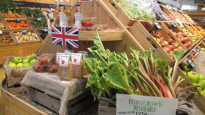 Traditional produce boxes filled with fresh rhubarb